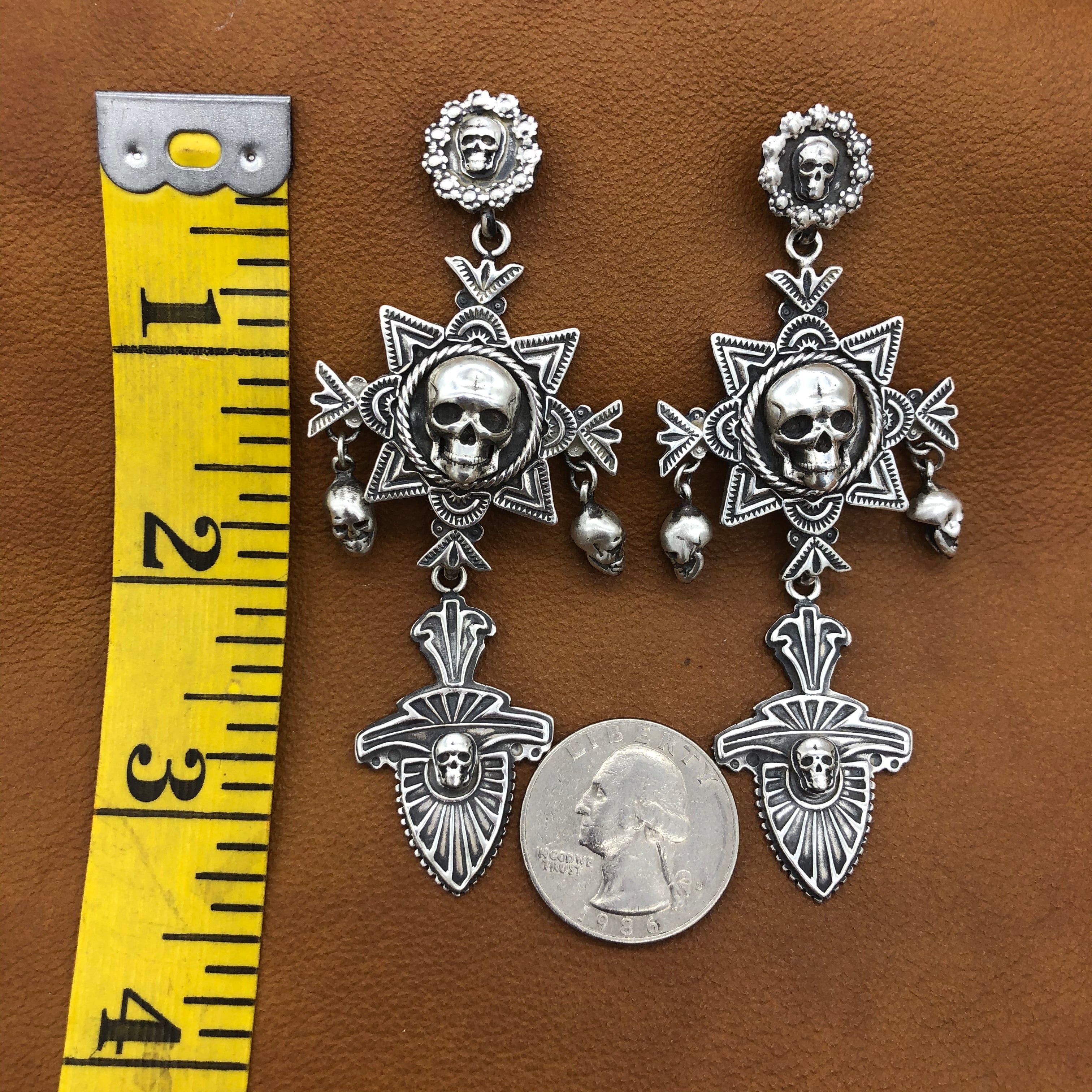 E211 Nambe Cross with Skulls Earrings